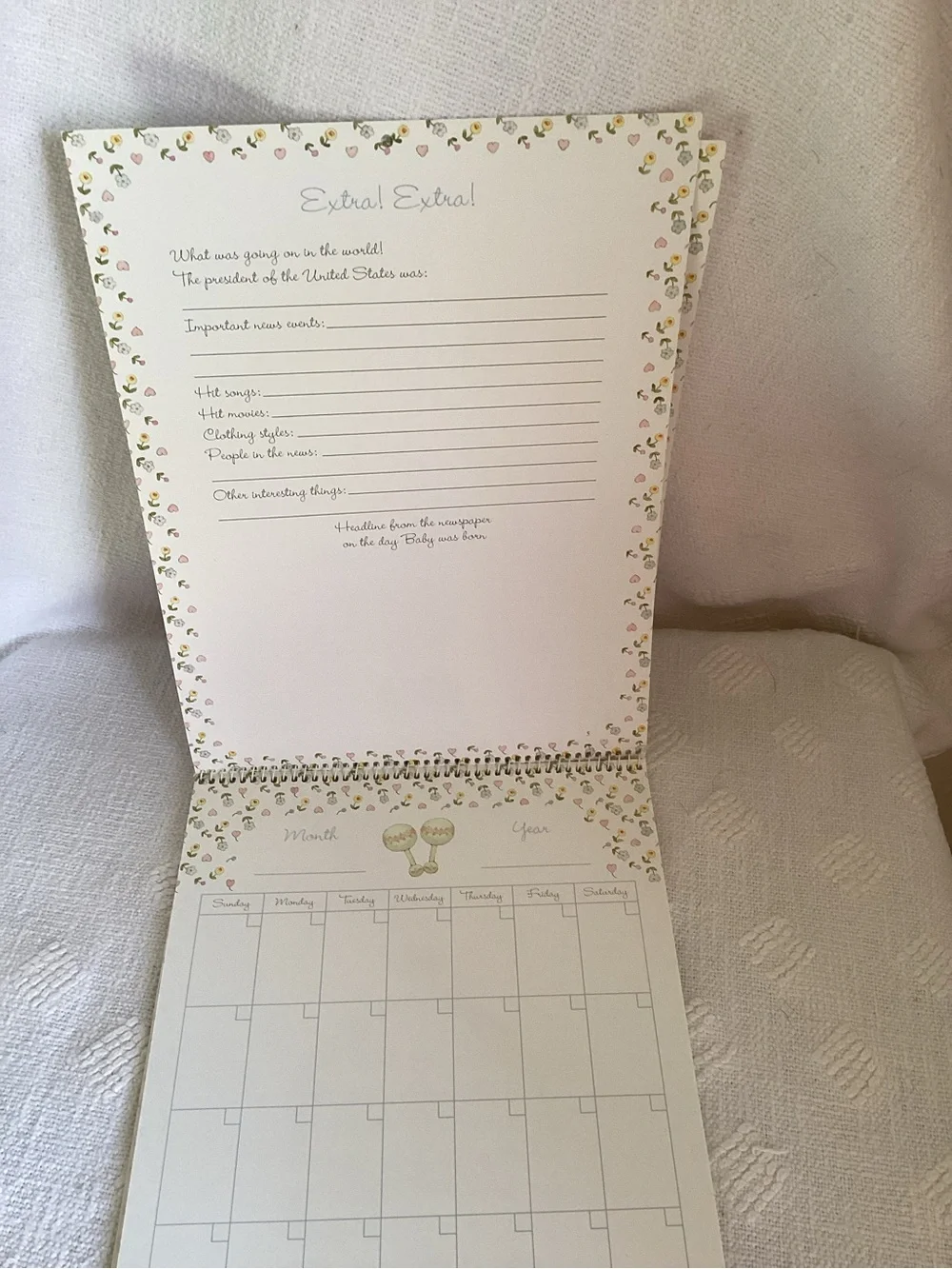 Baby’s first year calendar and milestone hardcover keepsake book